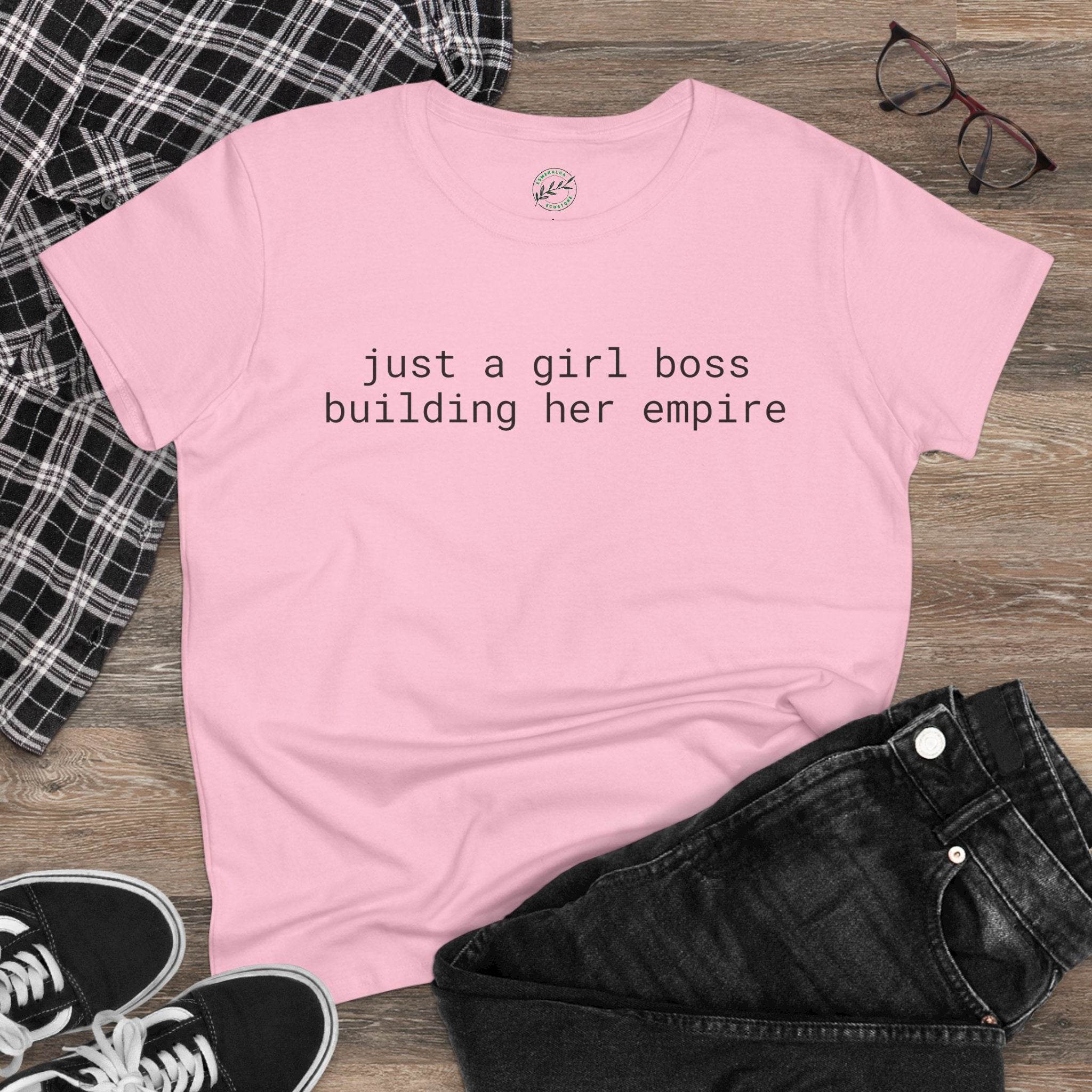 Printify eco-friendly girl boss shirt pink tee with just a girl boss building her empire text flat lay with jeans and sneakers