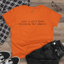 Orange t shirt reading just a girl boss building her empire flatlay with jeans sneakers glasses eco-friendly girl boss shirt