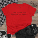 Red T shirt with printed slogan just a girl boss building her empire flat lay with jeans and sneakers eco-friendly girl boss shirt