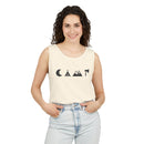 Smiling woman wearing Printify eco-friendly unisex tank top in cream with black camping icons and jeans