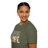 Printify model wearing olive green eco-friendly camping t-shirt with Camping Life print smiling in studio