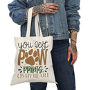 Printify eco-friendly paw print tote bag featuring You Left Paw Prints On My Heart design held by person