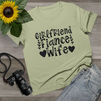 Printify sage green tee laid flat with Girlfriend Fiance Wife text and sunflower props eco-friendly women's relationship tee