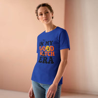 Woman wearing blue eco friendly halloween t shirt women printed with In My Good Witch Era text and moon graphic