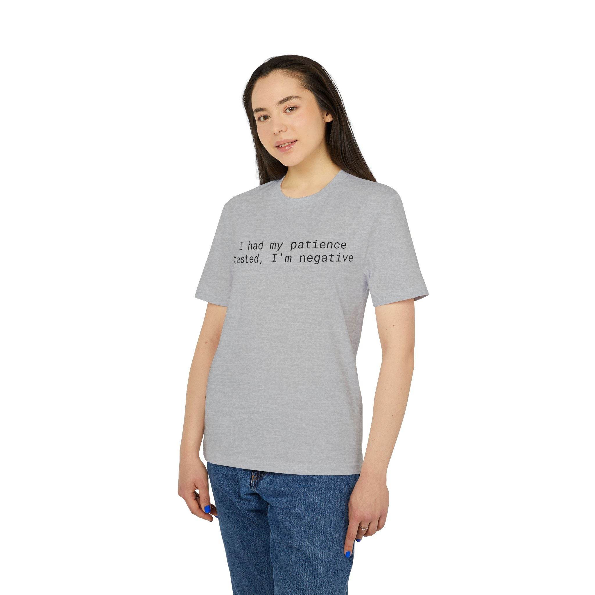 Young woman wearing gray eco-friendly unisex t-shirt with printed text I had my patience tested, I'm negative