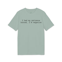 Sage green eco-friendly unisex t-shirt with black typewriter text reading I had my patience tested I am negative