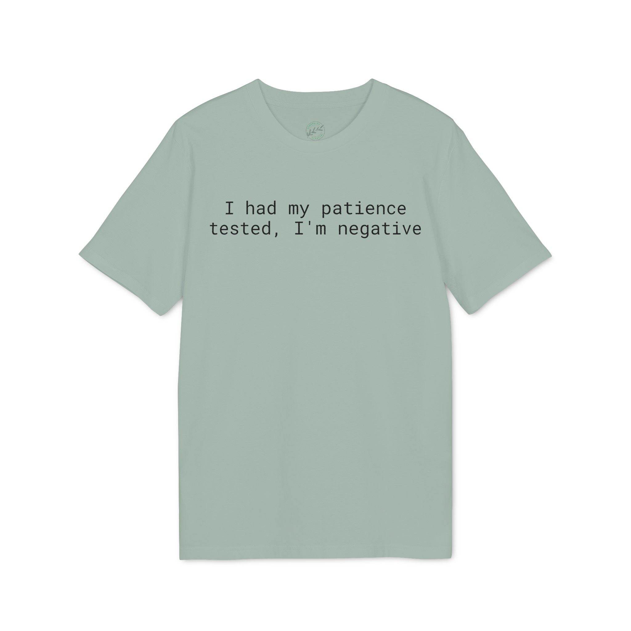 Sage green eco-friendly unisex t-shirt with black typewriter text reading I had my patience tested I am negative