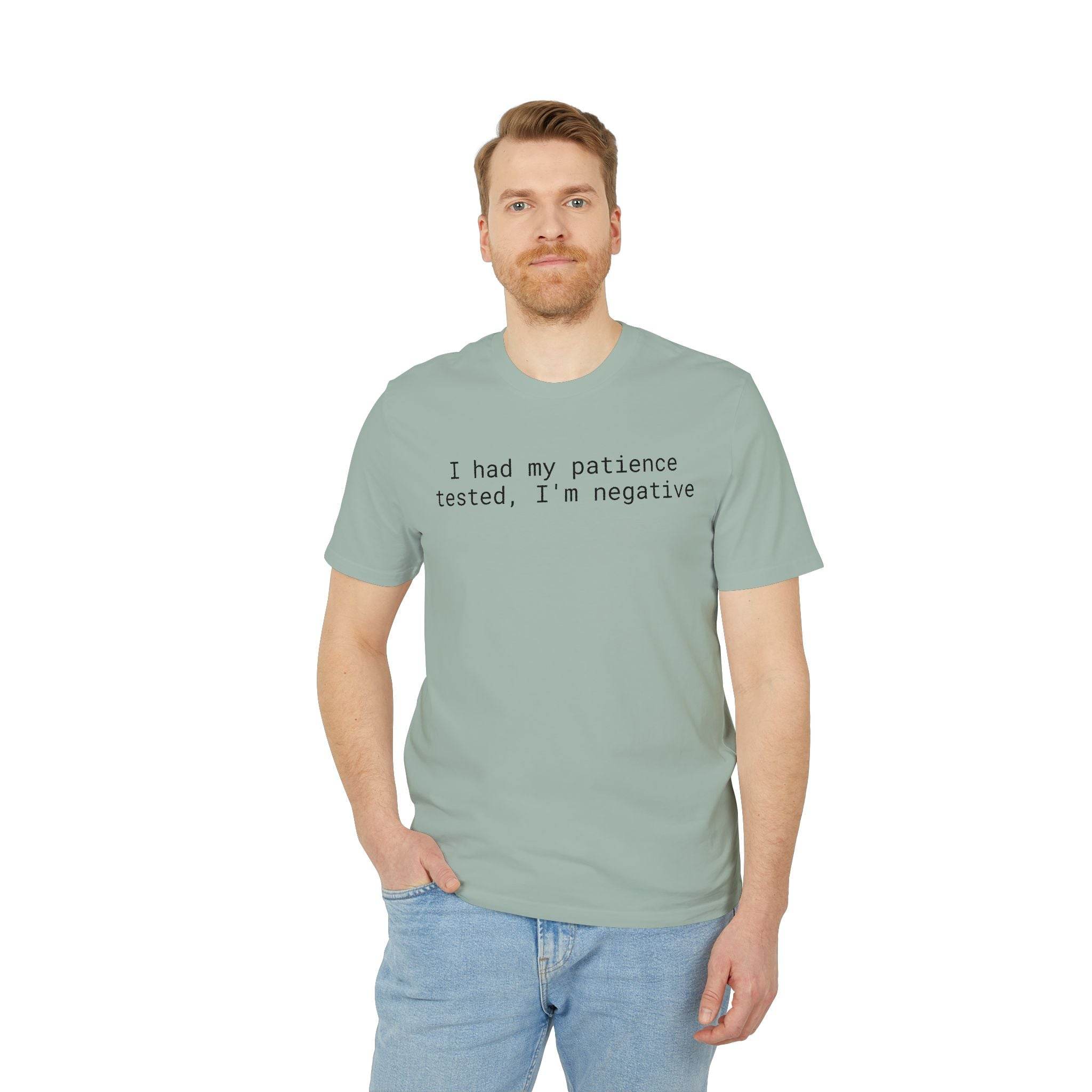 Male model wearing sage green eco-friendly unisex t-shirt with black text I had my patience tested Im negative casual fit