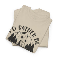 Printify beige folded t shirts with Id Rather Be mountain and pine trees graphic eco-friendly camping t-shirt