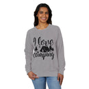 Printify gray sweatshirt worn by smiling woman featuring I love camping tent and trees graphic eco-friendly camping sweatshirt