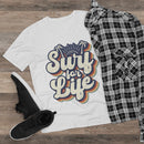 White men eco-friendly v-neck t-shirt with Surf for Life graphic paired with black plaid shirt and black sneakers