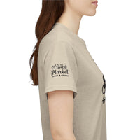 Side view of model wearing beige eco-friendly unisex t-shirt with Off the Market sleeve logo