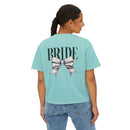 Printify mint cropped eco-friendly bridal t-shirt with large BRIDE text and silver bow graphic on back, worn by model