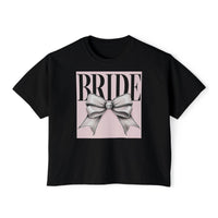 Printify black cropped tee with pink square and silver bow graphic reading BRIDE eco-friendly bridal t-shirt