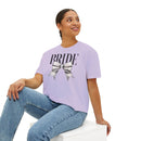 Woman wearing a Printify eco-friendly bridal t-shirt in lavender with BRIDE text and silver bow seated in jeans