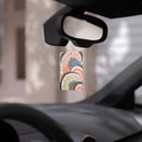 Scent-sational eco-friendly car air fresheners hanging from a car mirror with colorful design