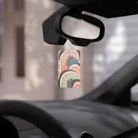 Scent-sational eco-friendly car air fresheners hanging from a car mirror with colorful design
