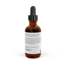 Amber glass dropper bottle of Rapunzel hair tonic for growth by Printify showing ingredient label on white background