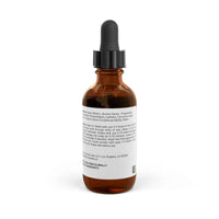 Amber glass dropper bottle of Rapunzel hair tonic for growth by Printify showing ingredient label on white background