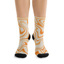 Printify orange and cream swirl pattern recycled poly socks with black heel and toe