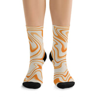 Printify orange and cream swirl pattern recycled poly socks with black heel and toe