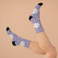 Purple floral design recycled poly socks by Printify worn on feet with black heels and toes