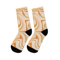 Printify recycled poly socks with abstract orange and beige swirl design and black heel and toe accents