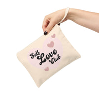 Printify eco-friendly zipper pouch with Self Love Club design held by hand with strap