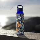 Printify stylish eco water bottle with blue cap and colorful floral design outdoors