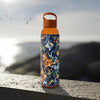 Printify stylish eco water bottle with orange floral design and orange handle on outdoor stone surface