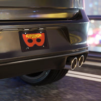 Black car rear with Printify Supermom vanity plate featuring a red mask design at night