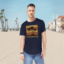 Printify eco friendly surfing t shirt worn by man on beach with palm tree graphic and lifestyle text