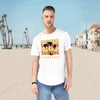 Printify eco friendly surfing t shirt with palm tree design worn by man on sunny beach
