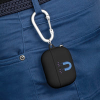 Black sustainable AirPods Pro cover with blue magnet design hanging on carabiner clipped to blue pants