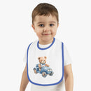 Toddler wearing Printify sustainable baby bib with teddy bear driving a blue car design