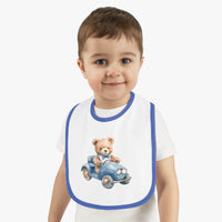 Toddler wearing Printify sustainable baby bib with teddy bear driving a blue car design