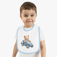 Toddler wearing Printify sustainable baby bib with blue trim and teddy bear driving a blue car design