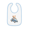Printify sustainable baby bib with blue trim featuring a teddy bear driving a blue car design