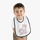 Child wearing Printify sustainable baby jersey bib with cute hippo design and black trim