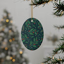 Printify sustainable ceramic holiday decorations with green leaves and red berries hanging on tree
