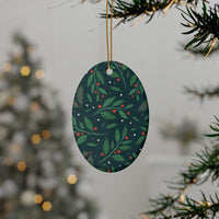 Printify sustainable ceramic holiday decorations with green leaves and red berries hanging on tree