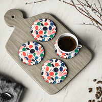 Printify kitchen accessories featuring colorful sustainable drink coasters with leaf patterns on a wooden board