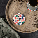 Printify sustainable drink coasters with colorful leaf pattern on wooden tray holding coffee cup