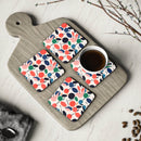 Printify kitchen accessories featuring colorful sustainable drink coasters with a cherry pattern on a wooden board