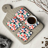 Printify kitchen accessories featuring colorful sustainable drink coasters with a cherry pattern on a wooden board