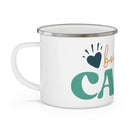 White sustainable enamel camp mug by Printify with teal and orange graphic design and silver rim