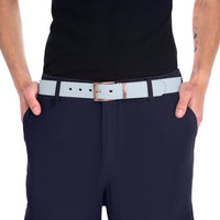 Close-up of person wearing a light gray sustainable fashion belt with metal buckle and navy pants