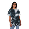 Printify sustainable fashion tie-dye shirt in black and white worn by smiling woman with jeans