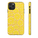 Printify phone case with vibrant yellow lemon slices pattern in sustainable lemon tough cases design