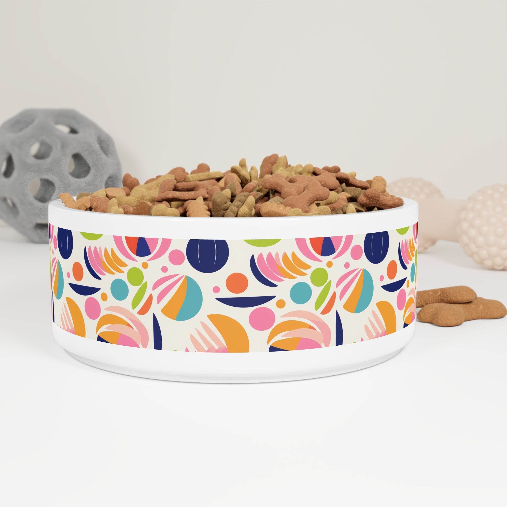 Printify sustainable pet bowl fancy design with colorful abstract pattern filled with dog treats